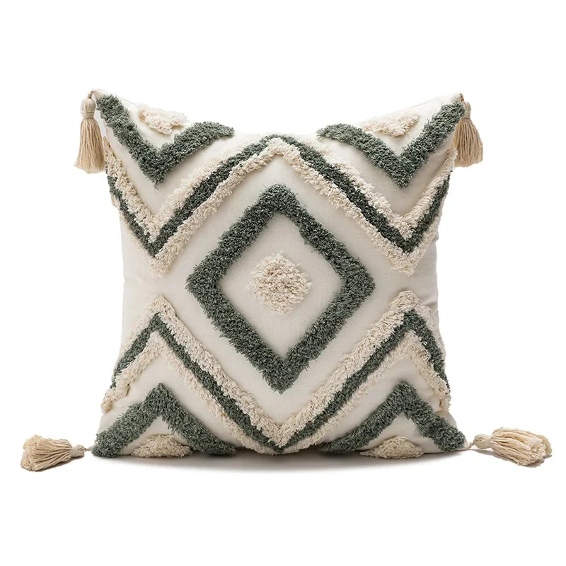 Coussin design vert avec losanges brodés