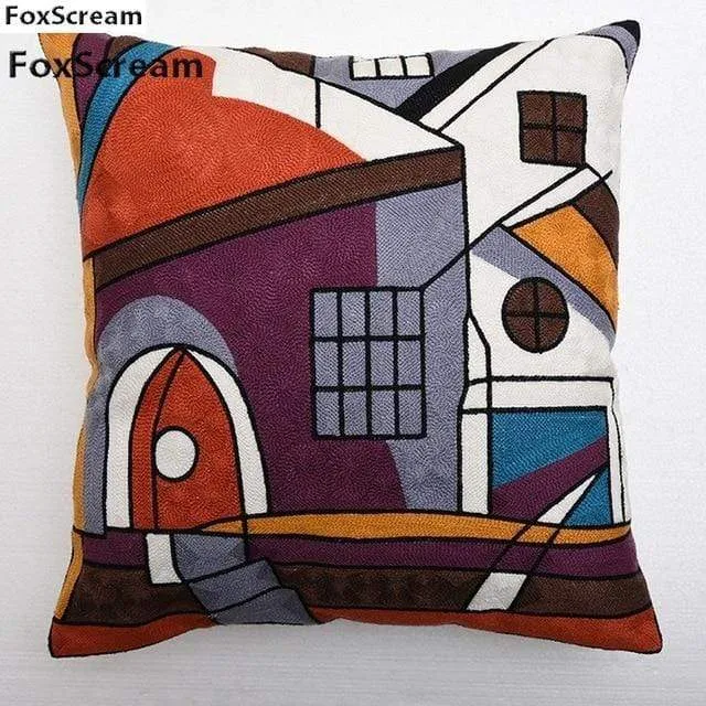 Housse de coussin brodée géométrique